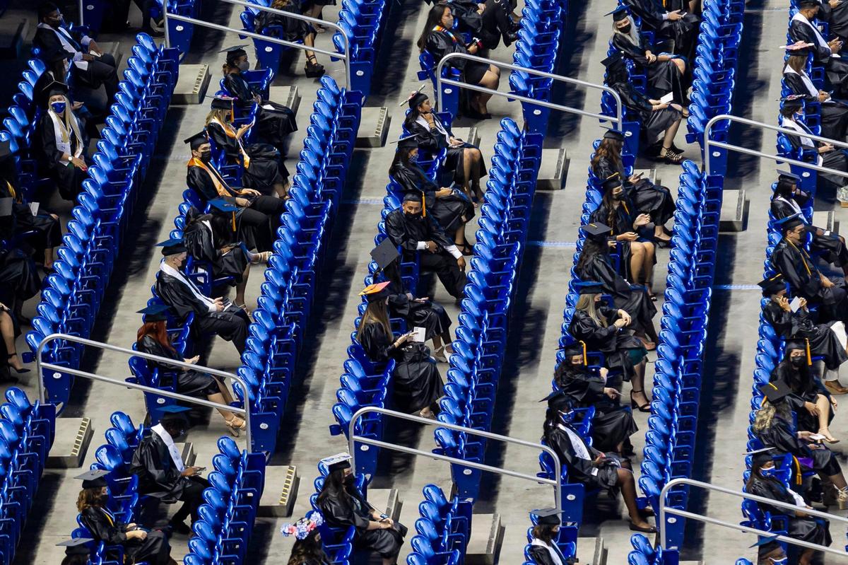 Miami Dade College students attend their graduation ceremony inside loanDepot park in Miami, Florida on Saturday, May 1, 2021.