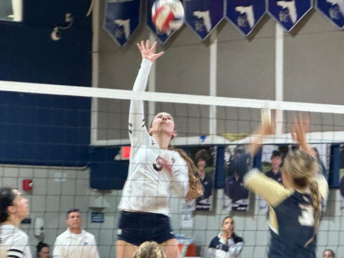 Gulliver libero Nicolette Penaranda tips the ball over the net during Friday’s Region 4-4A semifinal against Fort Lauderdale Calvary Christian at the Raiders’ gym.