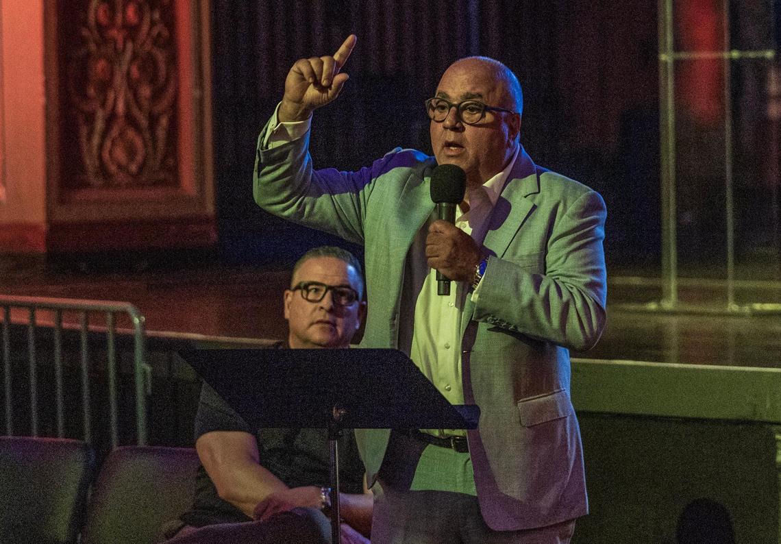City Manager Art Noriega listens as attorney for the Gusman family Tim Barket speaks during a meeting hosted by the city of Miami to discuss the proposed sale of the Olympia Theater at the Gusman Center for the Performing Arts’ entire building to a public charter school, called Sports Leadership Arts Management, (SLAM), in Miami, on Wednesday July 16, 2025.