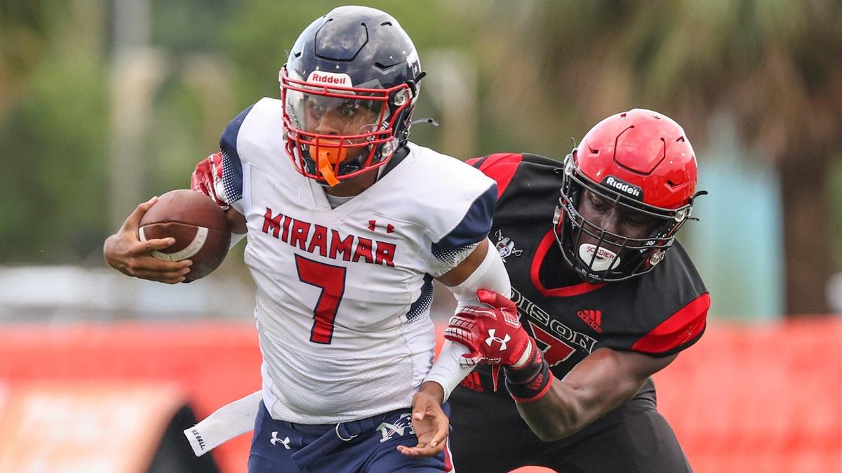 Miramar High School quarterback Jayvin Smart (7) is persued by Edison High’s linebacker Anthony Joicin (17) in the second quarter at Traz Powell Stadium in Miami, Florida on Friday, August 16, 2024.