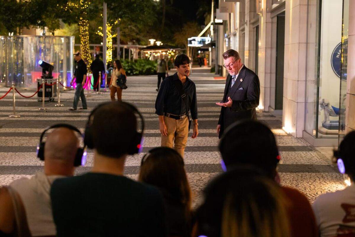 Audiences watch a scene featuring Carlos Fabian Medina and Steve Anthony in Miami New Drama’s “Lincoln Road Hustle.”