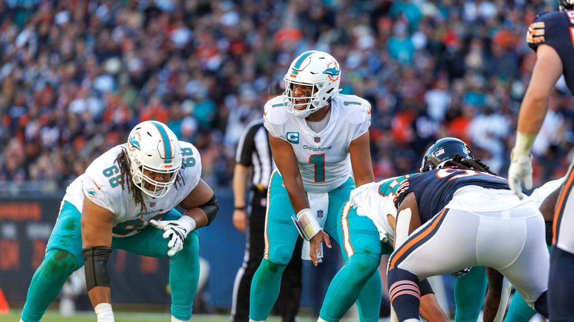 Miami Dolphins quarterback Tua Tagovailoa (1) calls a play during fourth quarter of an NFL football game against the Chicago Bears at Soldier Field on Sunday, November 6, 2022 in Chicago, Illinois.