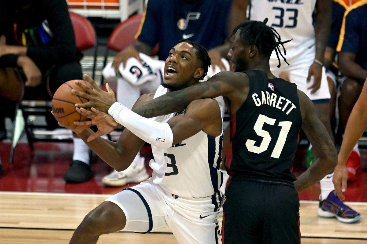 Utah Jazz guard Trent Forrest (3) drives to the basket against Miami Heat guard Marcus Garrett (51) during the first half of an NBA summer league basketball game Friday, Aug. 13, 2021, in Las Vegas.