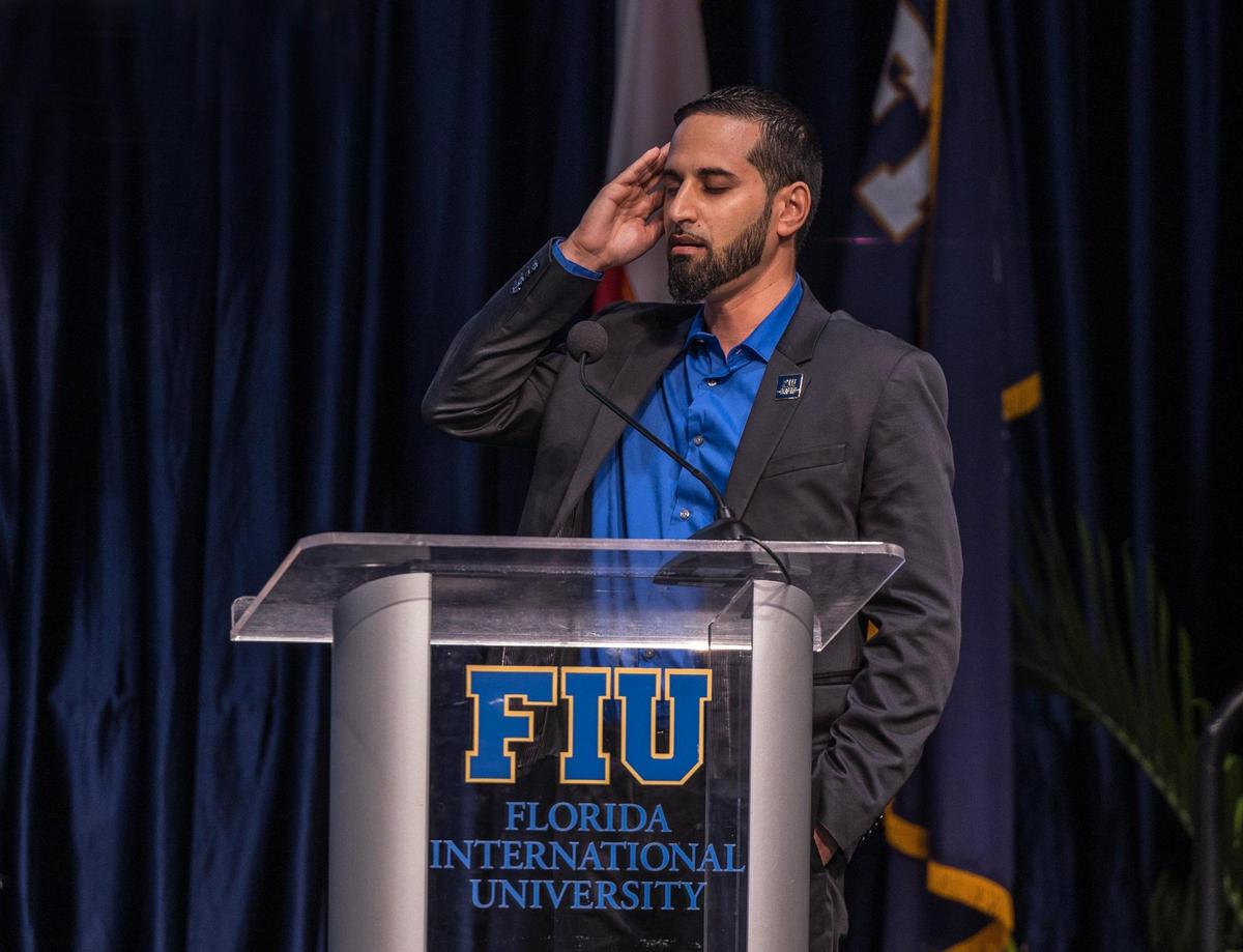 Dr. Mohamed K. Ghumrawi, assistant director of the Mohsin and Fauzia Jaffer Center for Muslim World Studies at FIU, leads a pray during the Florida International University Jaffer Center for Muslim World Studies’ annual interfaith iftar dinner.