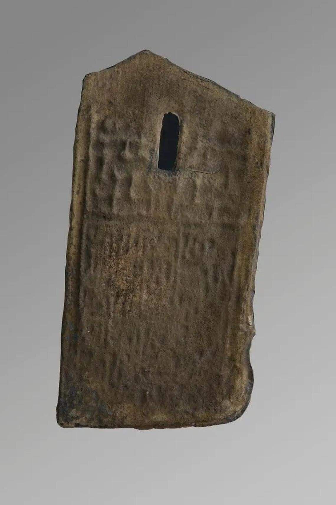 One of the bronze sword fragments with an engraving.