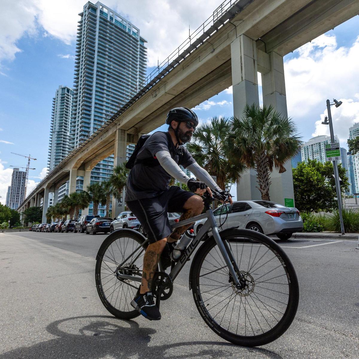Ahol Sniffs Glue departs on his bike to find more trash to draw on to leave for fans of his artwork to find.