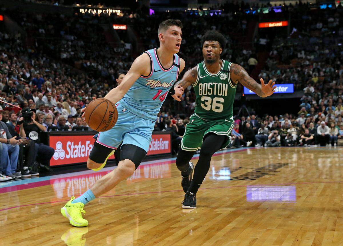Miami Heat guard Tyler Herro (14) drives against Boston Celtics guard Marcus Smart (36) during a recent game.