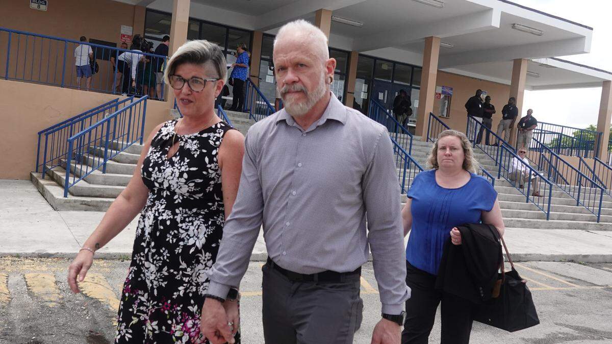 Jessica and Gary Norton, parents of a transgender student and volleyball player formerly of Monarch High School, leave a Broward County School Board meeting at Plantation High School, Tuesday, July 23, 2024. The board delayed voting on the mother’s school district employment status for another week. (Joe Cavaretta/South Florida Sun Sentinel)