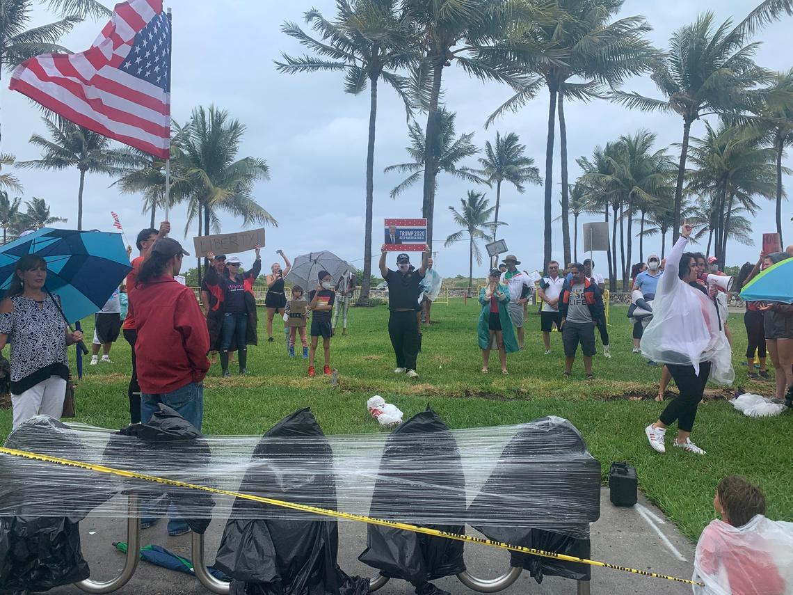 A small crowd of protesters gathered in Lummus Park in Miami Beach on Sunday, May 10, to express frustration with county orders keeping the beach and non-essential businesses closed due to COVID-19.