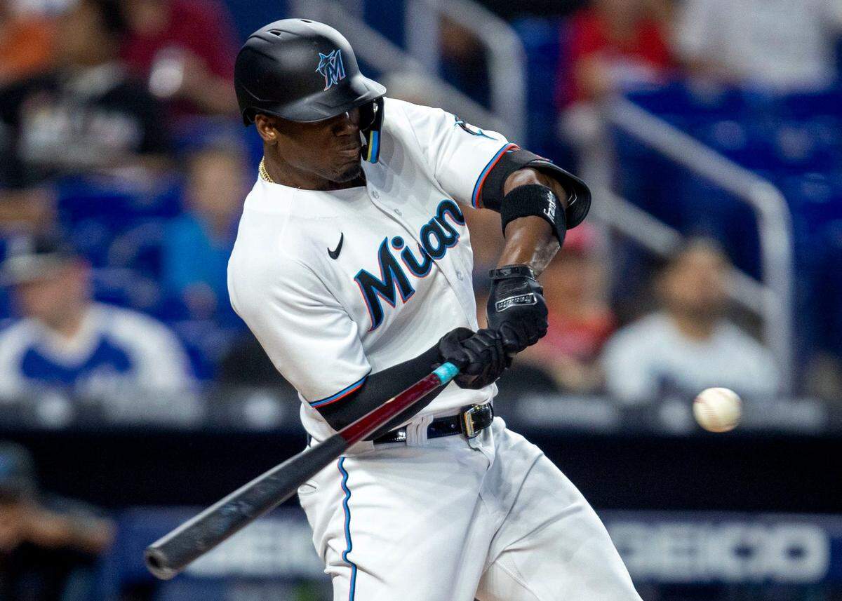 Miami Marlins batter Jorge Soler (12) swings at a pitch during the first inning of a baseball game against the Philadelphia Phillies at LoanDepot Park on Sunday, April 17, 2022 in Miami, Florida.