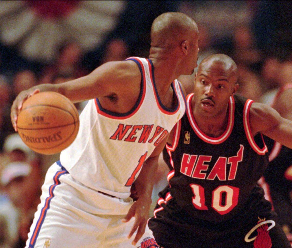 New York Knicks guard Chris Childs, left, looks for an open man as he is guarded by Miami Heat guard Tim Hardaway (10) during the first quarter Monday, May 12, 1997 at Madison Square Garden in New York. (AP Photo/Mark Lennihan)