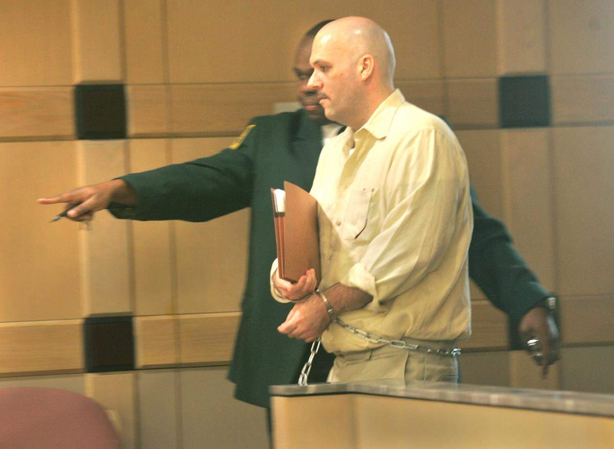 Howard Steven Ault is taken by bailiff to be fingerprinted on October 24, 2007, after Broward County Circuit Judge Marc Gold read his sentence, at Broward County Courthouse, for murder and sexually abusing two young girls. He was sentenced to death.