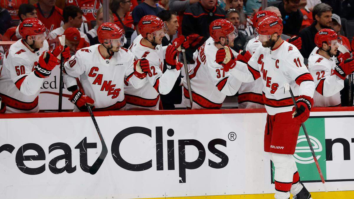 May 15, 2025; Washington, District of Columbia, USA; Carolina Hurricanes center Jordan Staal (11) celebrates with teammates after scoring a goal against the Washington Capitals in the first period in game five of the second round of the 2025 Stanley Cup Playoffs at Capital One Arena. Mandatory Credit: Geoff Burke-Imagn Images