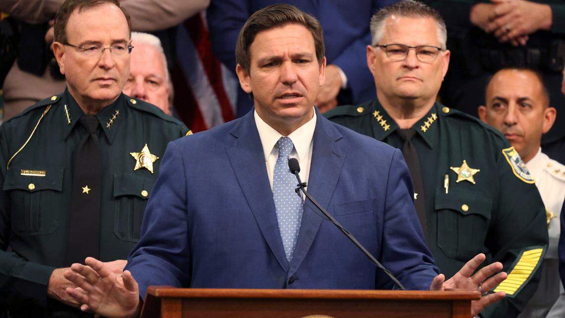 Gov. Ron DeSantis holds a news conference at the Polk County Sheriff’s Office in Winter Haven, Fla., on Monday, April 19, 2021, surrounded by law enforcement, legislators, and police union representatives, to sign a bill to create tougher penalties for people who participate in violent protests. (Ricardo Ramirez Buxeda/Orlando Sentinel via AP)