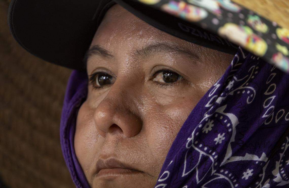 Claudia, a farmworker, listens to speakers as she participates in the launch of WeCount!'s Planting Justice campaign at its headquarters on Saturday, Feb. 14, 2026, in Homestead, Fla. The campaign urges major retailers and growers to adopt a new Code of Conduct for plant nursery workers in their supply chains and agree to independent monitoring, enforcement and certification.