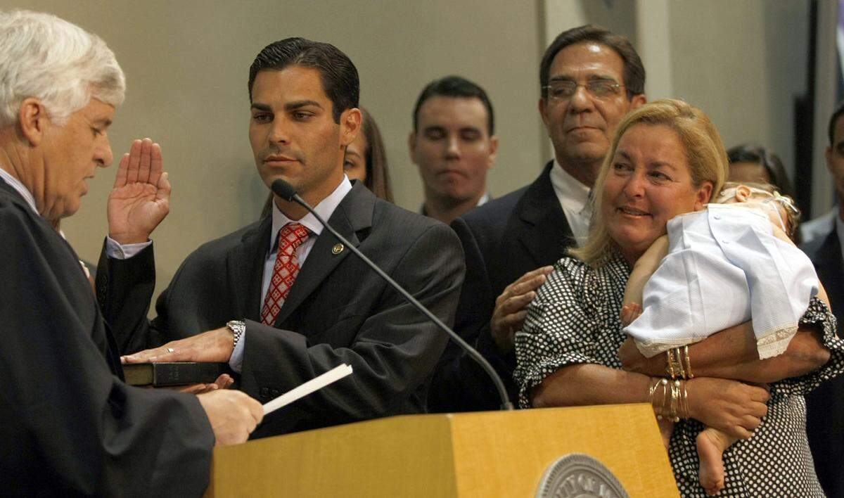 Francis Suarez, the newly elected city commissioner for District 4, is sworn in on Nov. 17, 2009, surrounded by his mother Rita Suarez, father Xavier Suarez and other family members at Miami City Hall.