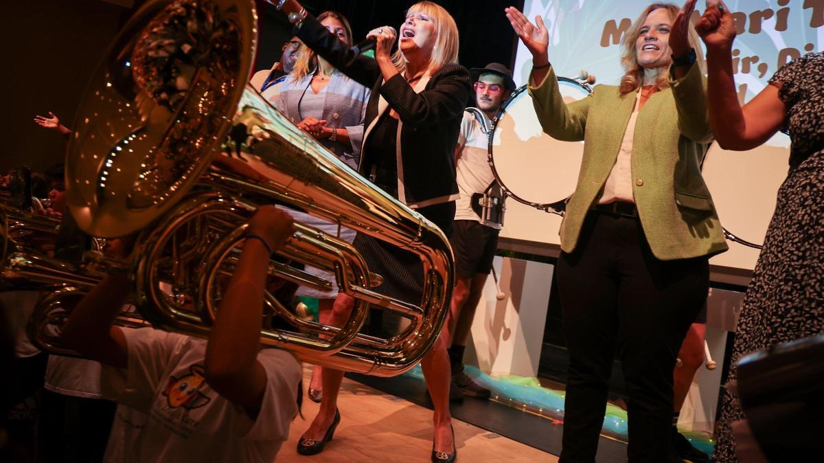 School Board of Miami-Dade County Chair Ms. Mari Tere Rojas, center, leads the audience of about 450 new teachers in a cheer as the high school’s band performed at the New Teacher Orientation at Hialeah Gardens Senior High on Monday, August 7, 2023.