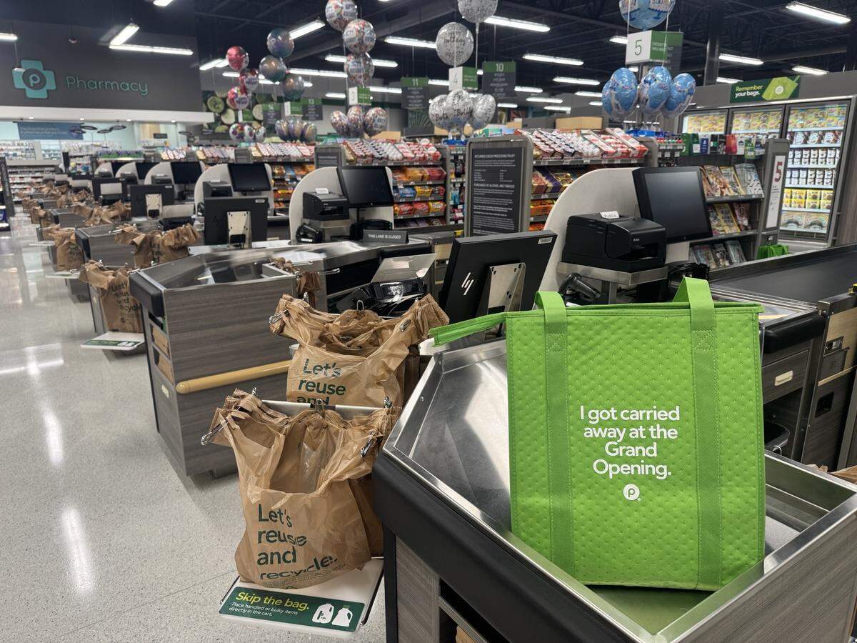 Publix greeted customers at the 7 a.m. grand opening of its long-awaited rebuilt Briar Bay store with custom bags on Feb. 27, 2025.
