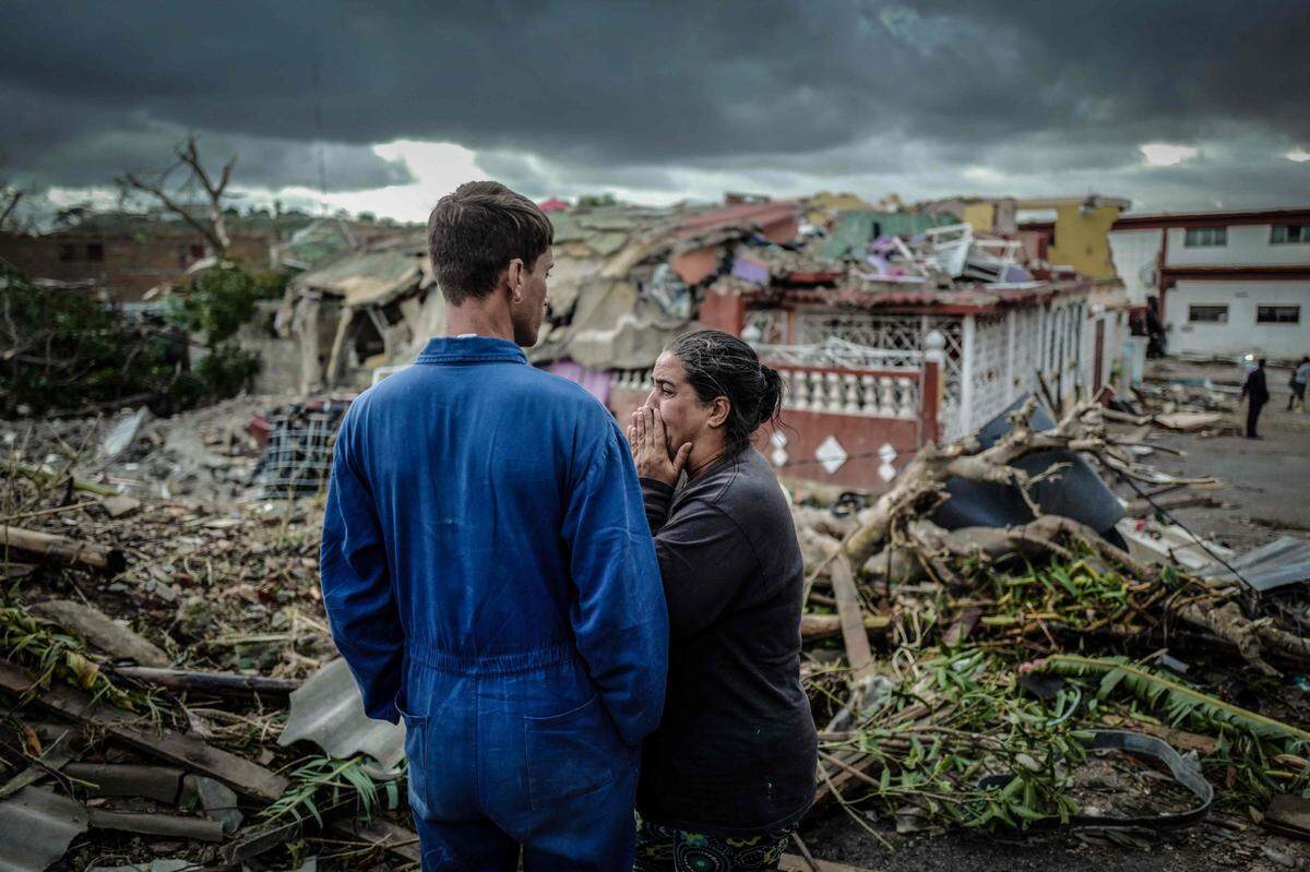 A resident of tornado-hit Regla neighborhood cries in front of her destroyed house in Havana on Jan. 28, 2019. A rare and powerful tornado that struck Havana killed three people and left 172 injured, Cuban President Miguel Diaz-Canel said early Monday.