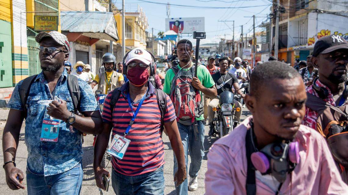 Journalists march in the streets after a truck carrying journalists was targeted with tear gas as they covered a protest against the Haitian president, in Port-au-Prince, February 10, 2021. Haitian police fired tear gas on hundreds of protesters who were marching against President Jovenel Moïse in Port-au-Prince on February 10, and attacked journalists covering the demonstration, in the latest clashes to mark the country’s political crisis.