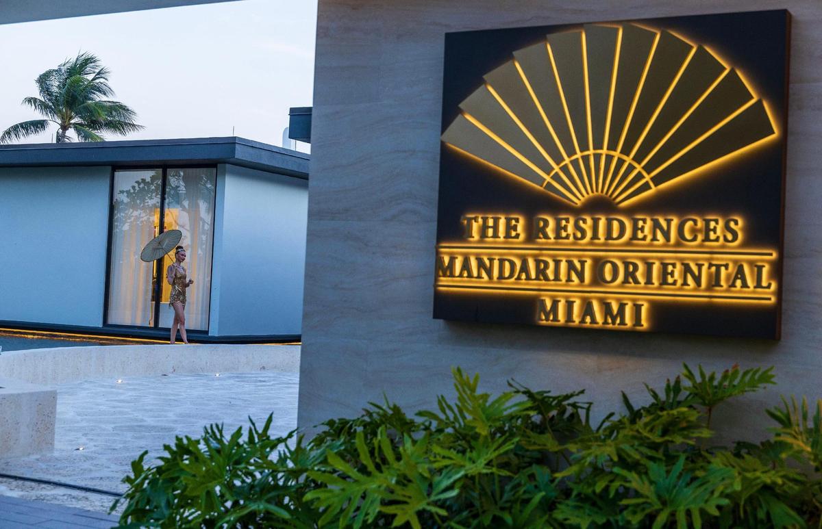 A dancer performs at the Mandarin Residences sales center during a hotel closing party on May 25, 2025.
