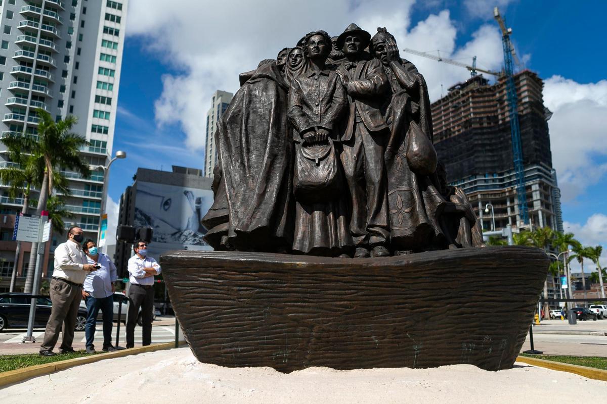 The traveling bronze sculpture titled “Angels Unawares,” is on display at Bayfront Park in downtown Miami on Wednesday, February 10, 2021. The life-sized sculpture will be open to the public daily for viewing until April 8. The sculpture weighs four tons and is 20-feet long. It features indigenous people, Jews fleeing Nazi Germany, Joseph, Mary, Jesus, and much more.