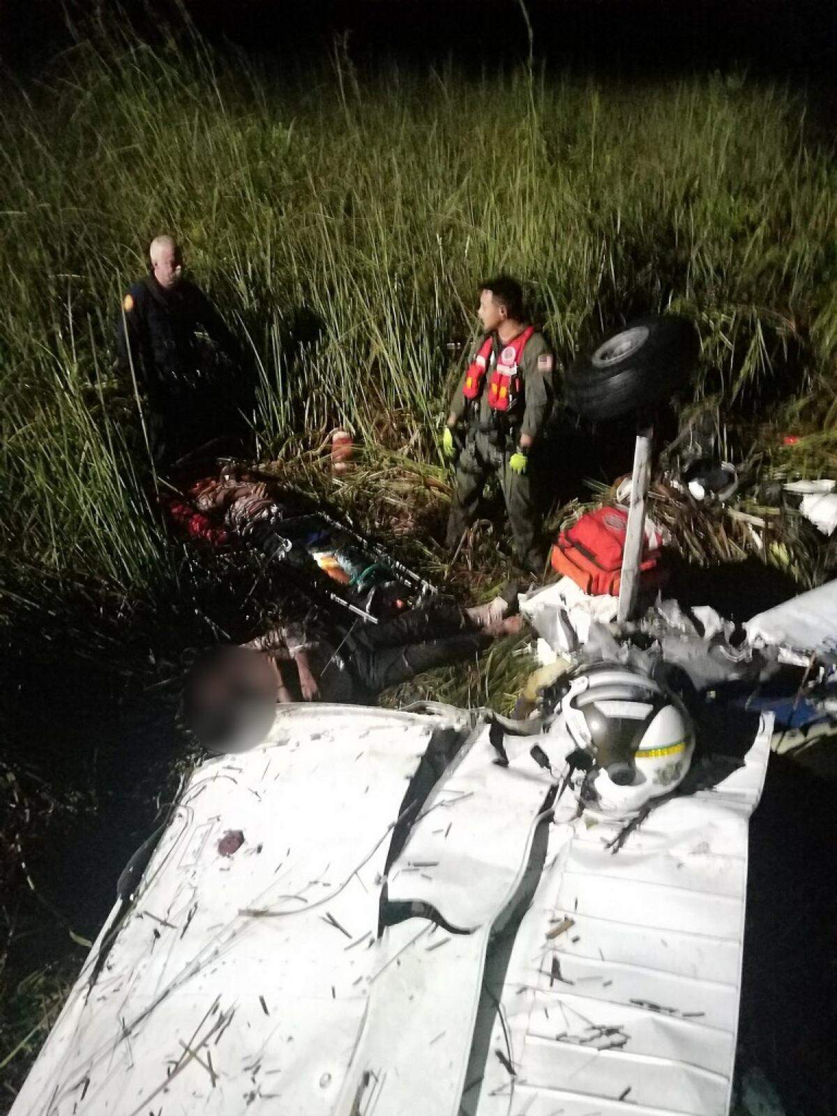 Rescue crews on the scene of a single-engine plane crash in the Florida Everglades early Saturday morning, May 4, 2018. The plane, carrying two people, went down around 11:50 p.m. May 3, 2018.
