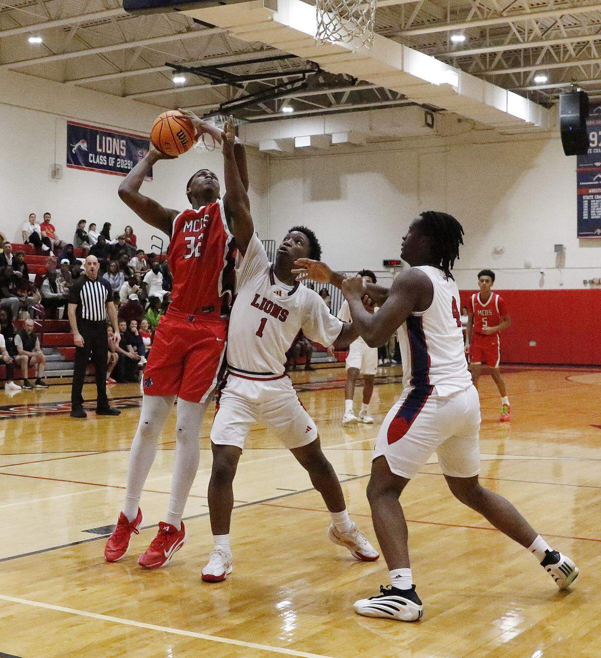 Miami Country Day Spartans Kaleb Corbitt (32) attempts a shot against Chaminade-Madonna Lions during the Region 4-2A quarterfinal boys basketball game on Saturday, February 14, 2026 at Chaminade-Madonna School in Hollywood. Andrew Uloza / for Miami Herald