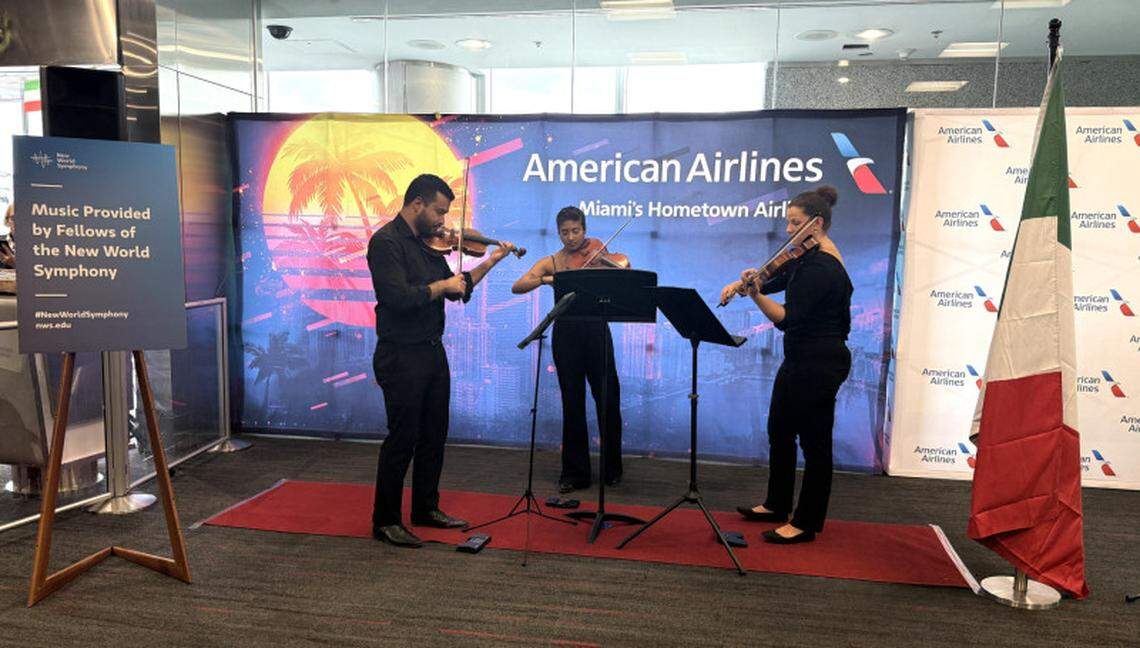 Musicians from the New World Symphony serenade the departure gate with classical Italian music.