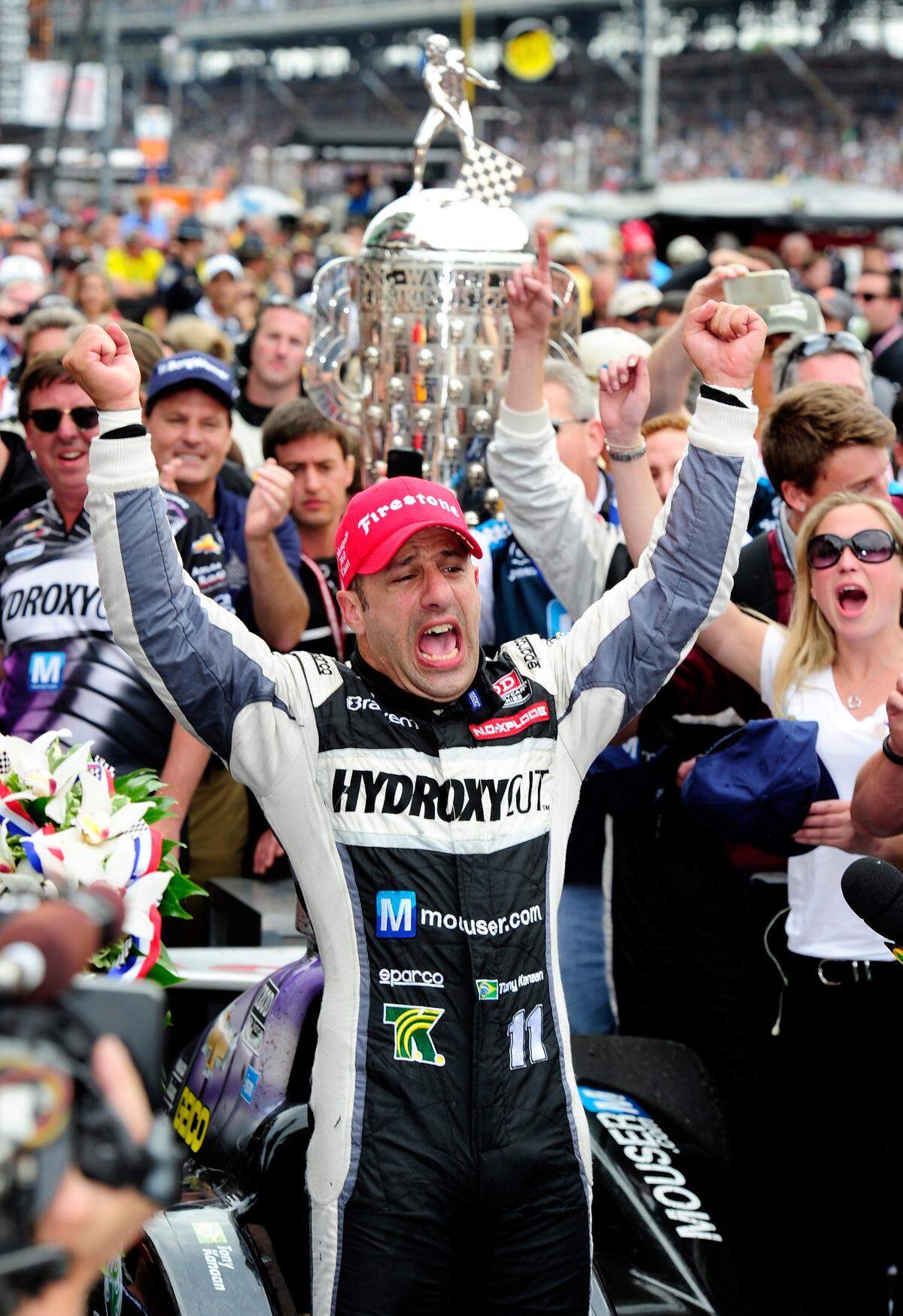 Miami resident Tony Kanaan of Brazil lets it all out after finally winning the 2013 Indianapolis 500 after numerous frustrating Mays at Indy.