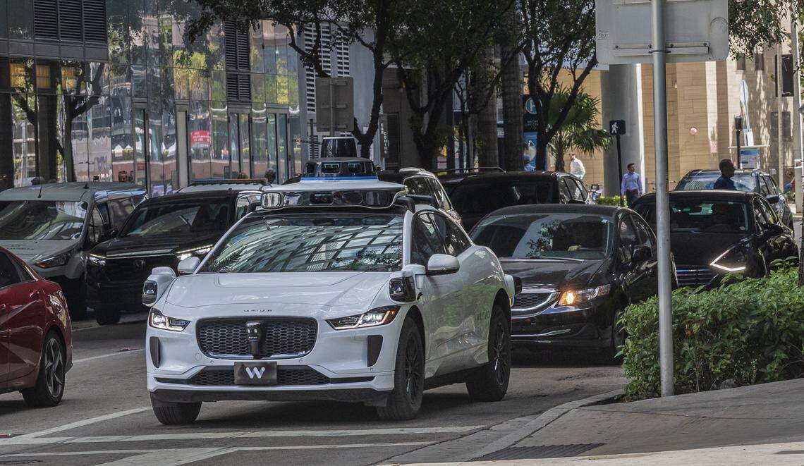 View of a Waymo self driving car at SW 7th Street and South Miami Avenue, with Miami Herald reporters Catherine Odom and Michael Butler, onboard, as they head to the Brickell Centre, to test the Waymo-Self-Driving Cars - Autonomous Vehicles - Ride-,on Wednesday, February 25, 2026.