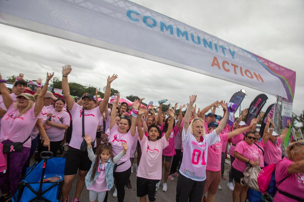 Participants cheer at the breast cancer walk at Amelia Earhart Park in Hialeah on Saturday, Oct. 19, 2024.