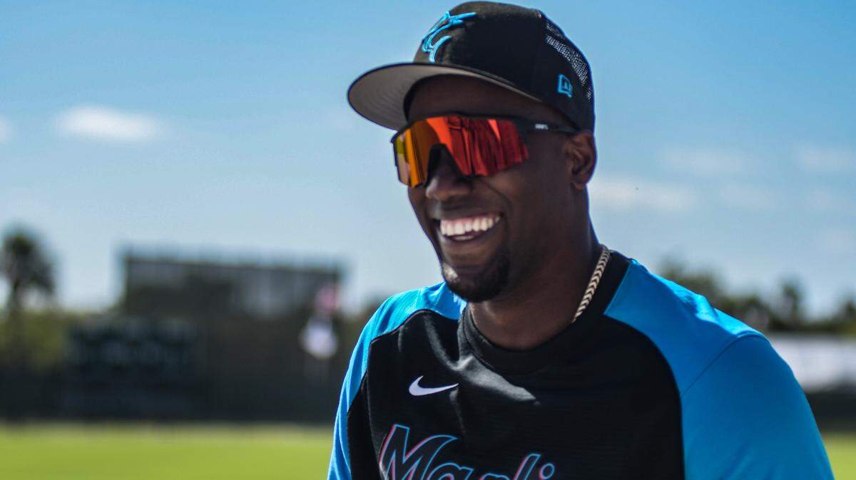 Miami Marlins outfielder/designated hitter Jorge Soler smiles as he walks off a back field of the Roger Dean Chevrolet Stadium complex in Jupiter, Florida, on Tuesday, March 22, 2022.