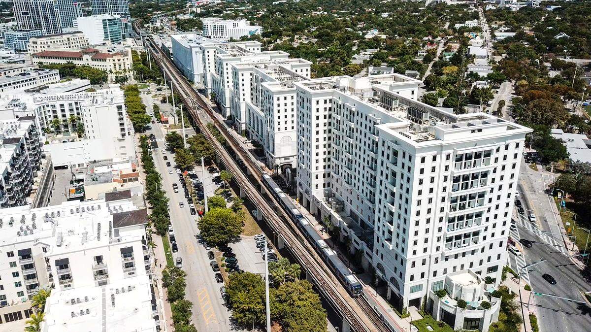 The massive Life Time Coral Gables residential and commercial development, at right, stretches between U.S. 1 and the Metrorail tracks along Ponce de Leon Boulevard in Coral Gables. At bottom left is the Gables Ponce apartment and office complex. At top left, the new Cascade and Core Link apartment towers rise at the Douglas Road Metrorail Station on the city of Miami sides of the neighborhood.