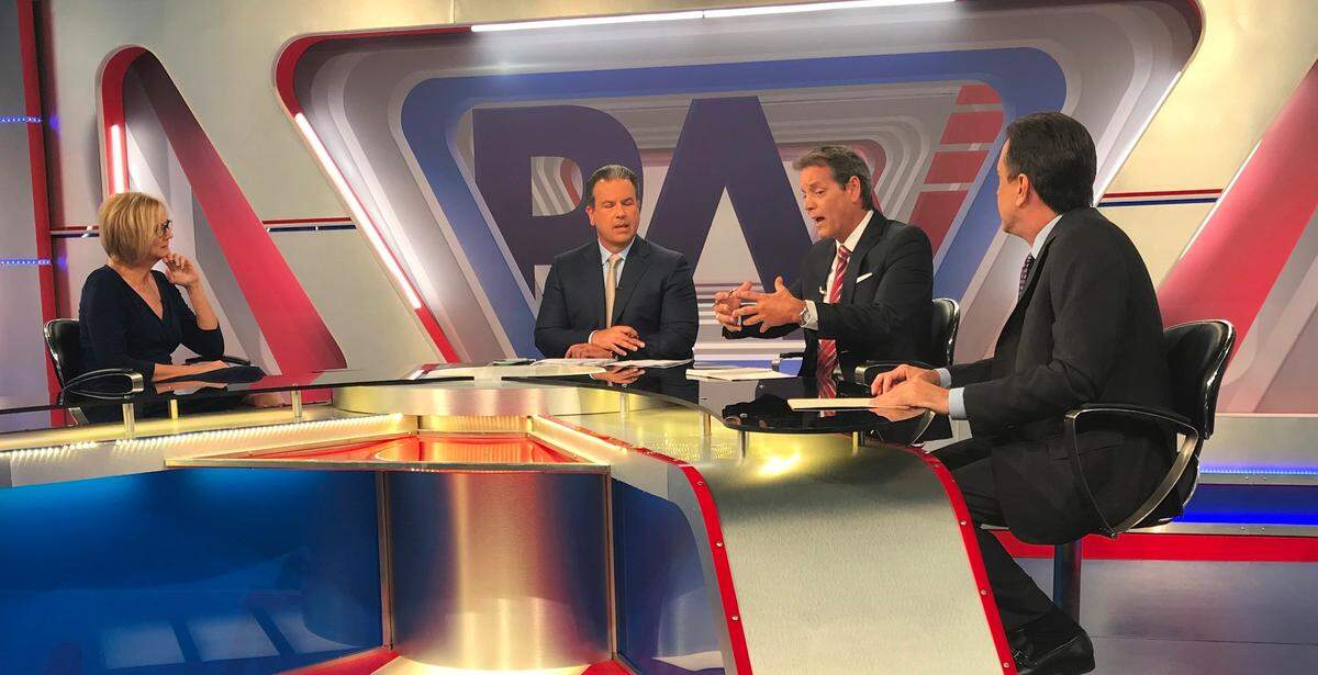 Carlos Garin, second from right, uses his hands to make a point during a taping of 'Preparen Apunten Voten' on América TeVé on Wednesday, May 9, 2018. He is a candidate for District 5 on the Miami-Dade County Commission. Two other candidates are in the studio with him: Eileen Higgins, left, and Alex Diaz de la Portilla, right. The moderator is Felix Guillermo.