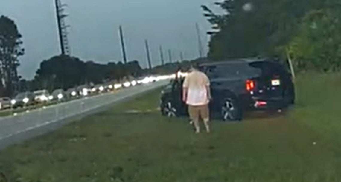 This video screengrab shows the moment the suspect began backing his way to a deputy’s vehicle prior to being handcuffed.