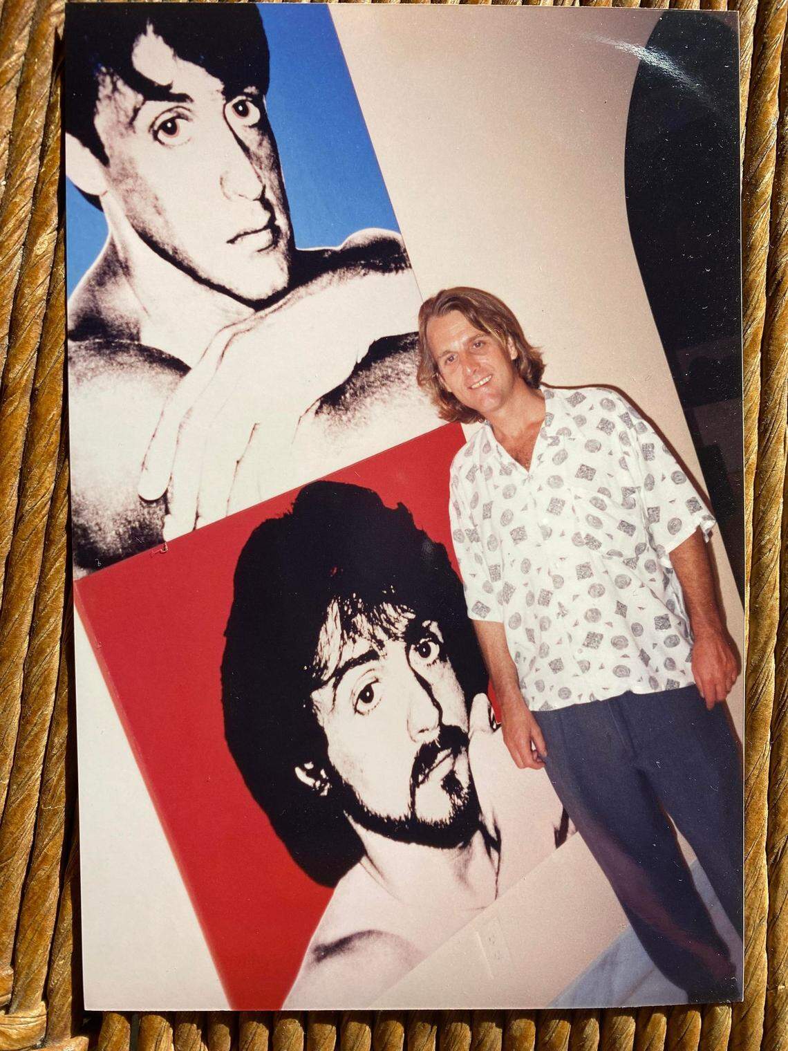 Tom Austin at Sylvester Stallone’s housewarming party in Miami, in from of Andy Warhol portraits, in 1996.