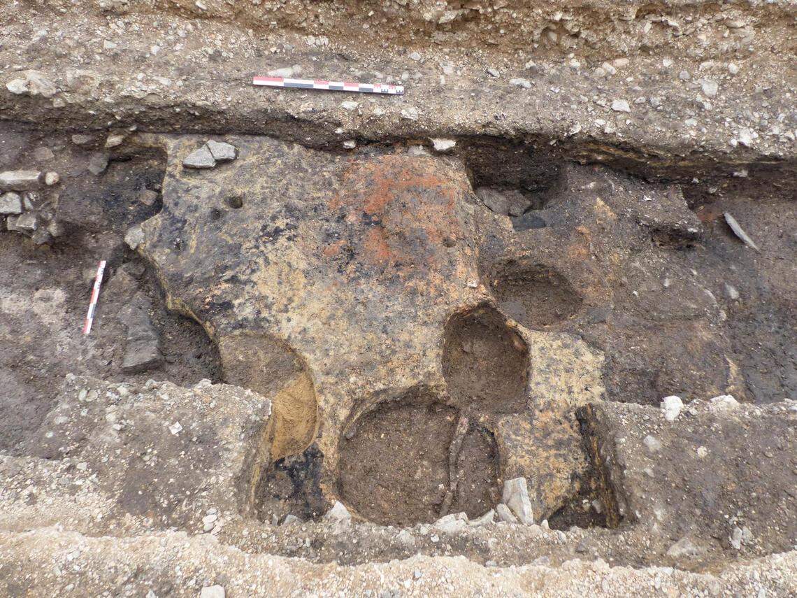 The site may have been a town that operated in the shadow of a powerful abbey on the other end of the square, officials said.