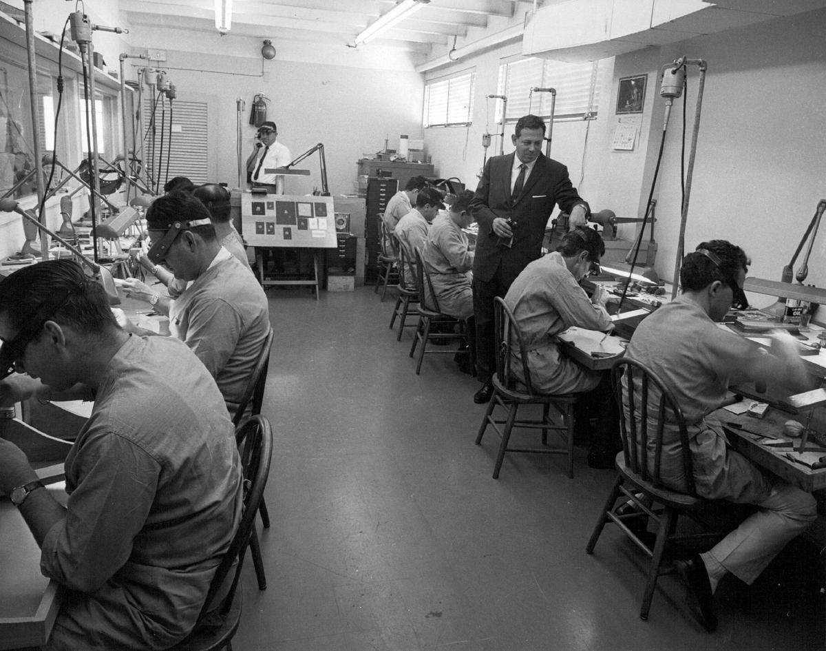 In 1963, precious gems and metals are fashioned into jewelry by these artisans in the Balogh workrooms on Arthur Godfrey Road.