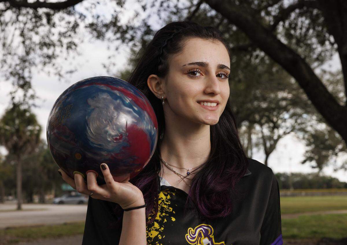 Sofia Montefusco, bowler of the year from South Plantation, poses with her ball during a photoshoot with the Miami Herald on Wednesday, Jan. 14, 2026, at Brian Piccolo Park in Hollywood, Fla.