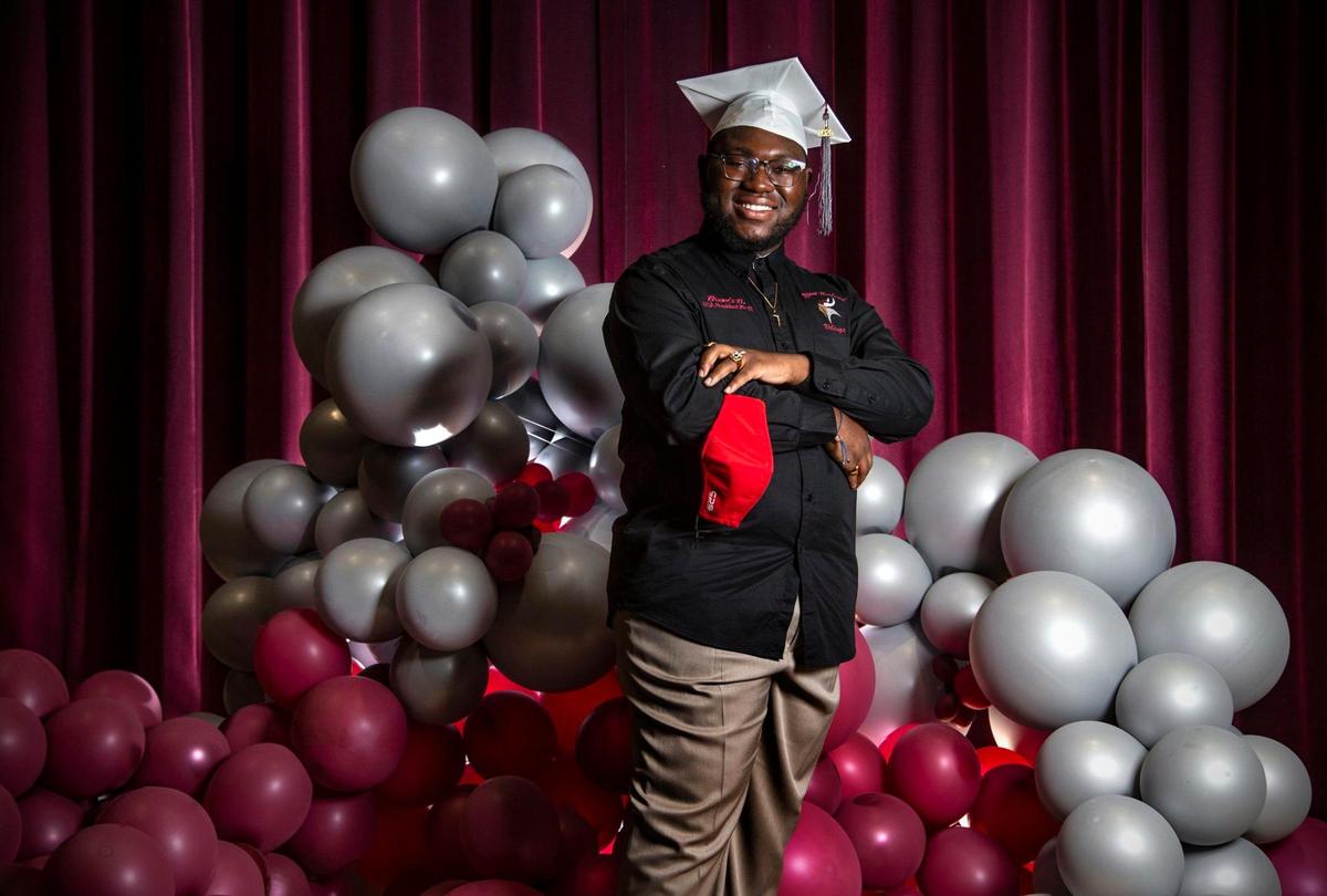 On stage at Miami Norland High School, graduate Brenis Bostick, 18, is a spoken word poet and participant of slam poet competitions on Thursday, June 10, 2021.