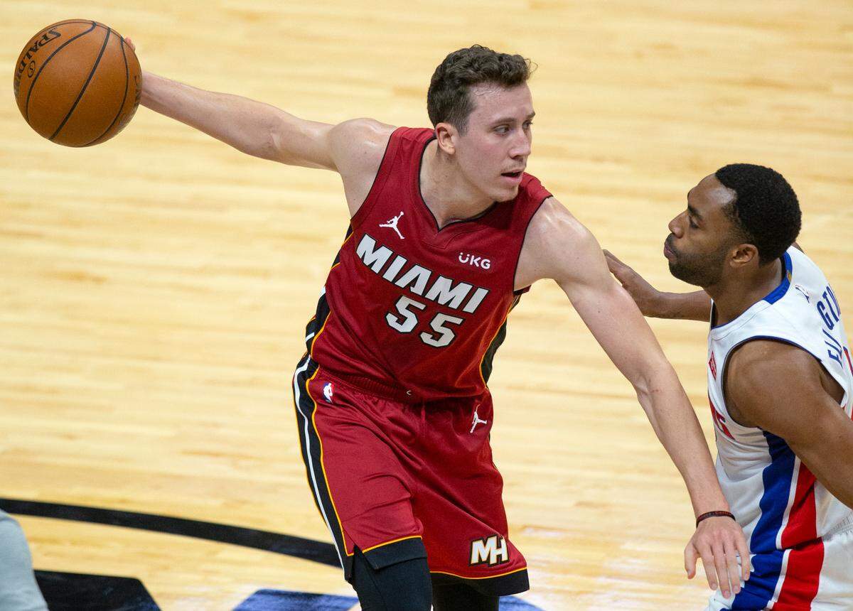Miami Heat forward Duncan Robinson (55) drives against Detroit Pistons guard Wayne Ellington (8) in the fourth quarter of an NBA basketball game at AmericanAirlines Arena on Saturday, Jan. 16, 2021.