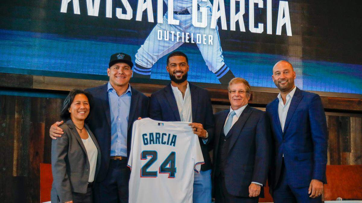 Newly signed Miami Marlins outfielder Avisaíl García is introduced to the media joined by Miami Marlins General Manager Kim Ng (left), starting pitcher Sandy Alcántara, Marlins Chairman and Principal Owner Bruce Sherman, and Marlins CEO Derek Jeter during a presentation event at the Biscayne Bay Brew Hall of loanDepot park in Miami, Florida, Wednesday, December 1, 2021.
