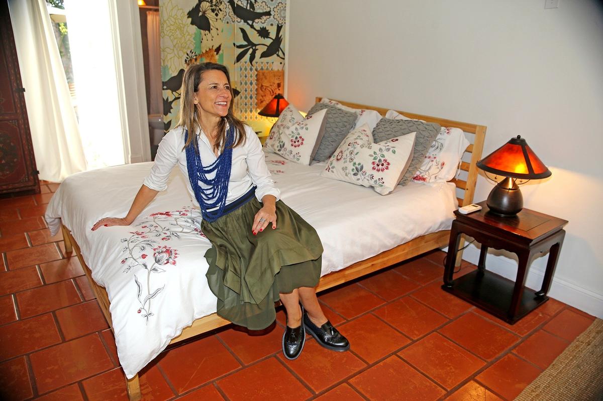 Paola Ugolini in her Biscayne Park cottage, which has become the most popular Airbnb listing in Florida.