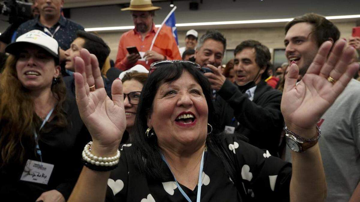 Opponents of Chile’s proposed constitution cheer as they hear the results of a plebiscite.