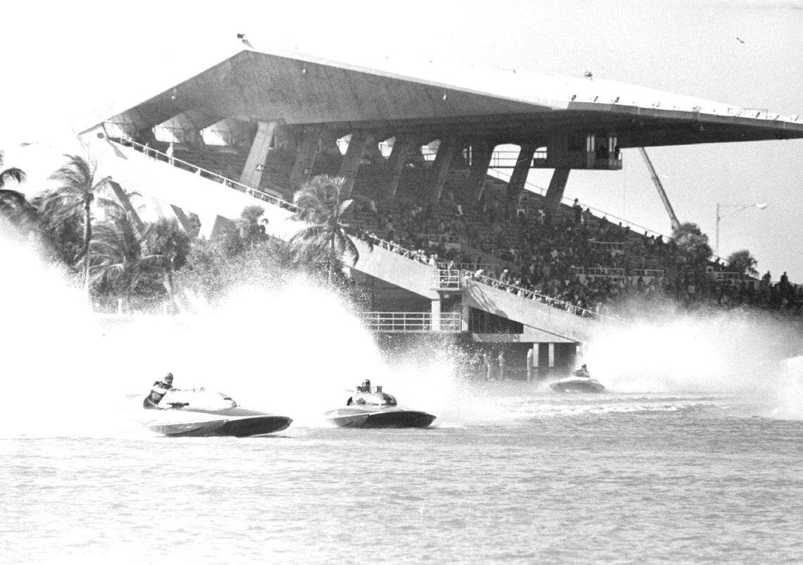 Powerful inboard hydros battle on the turn in grueling action at Miami Marine Stadium. The top formula hydros in the world, from as far away as Canada and California, and capable of Straightway speeds of 140-miles-per-hour, competed in the Grand Prix Winter Championships in the late 1970s.