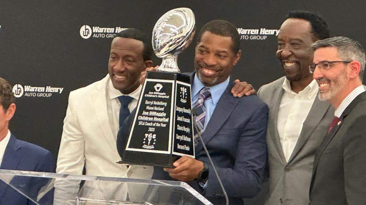 Miami Norland coach Daryle Heidelburg is honored with the Warren Henry Auto South Florida Coach of the Year award during a ceremony on Wednesday night at the Warren Henry Auto dealership in North Miami Beach.