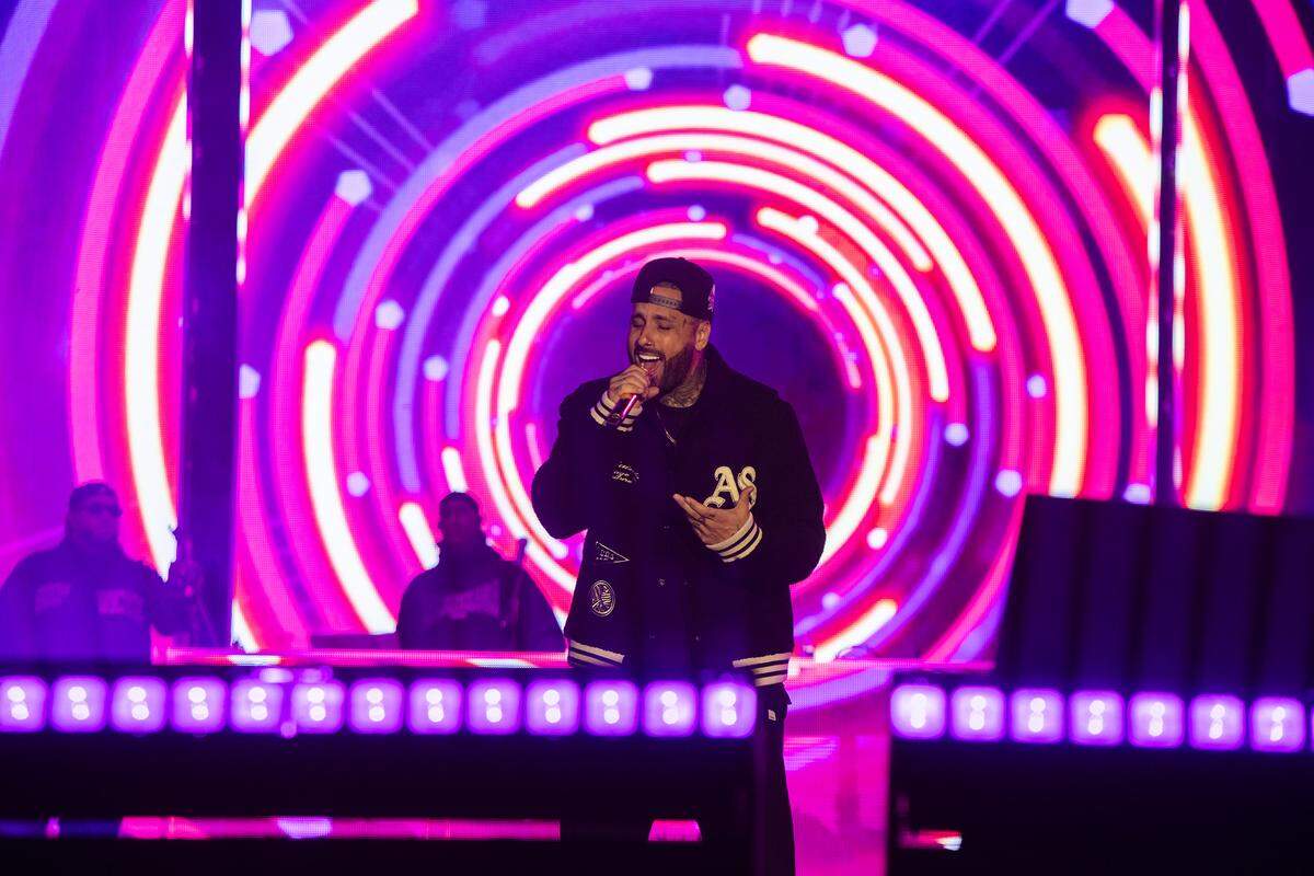 Nicky Jam performs during New Year’s Eve celebrations at Bayfront Park as crowds gather to welcome 2026.