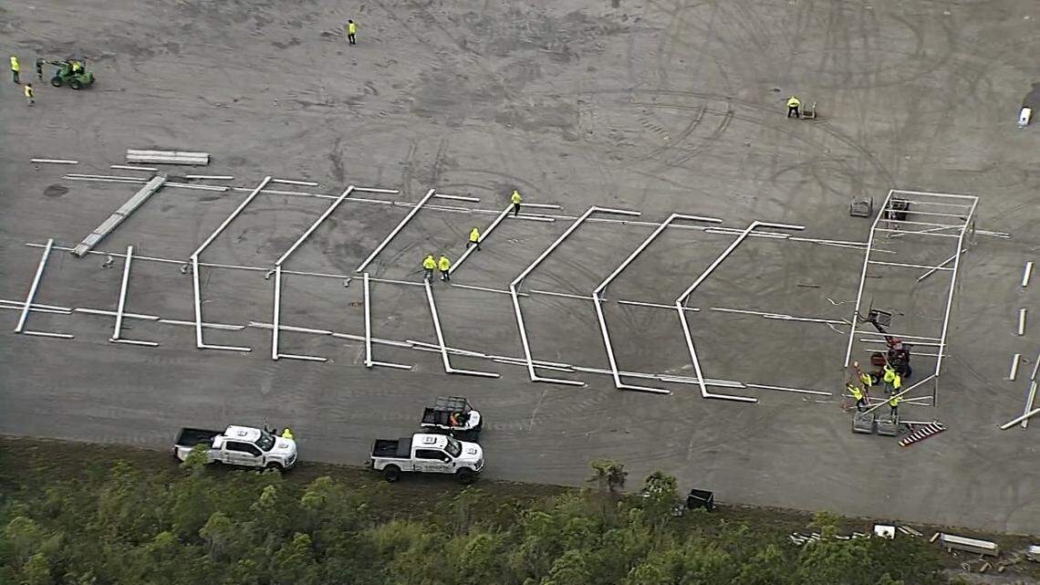 Ochopee, Fla., June 22, 2025 - Construction crews assemble what appear to be heavy duty tents during the building of the new immigration detention center.