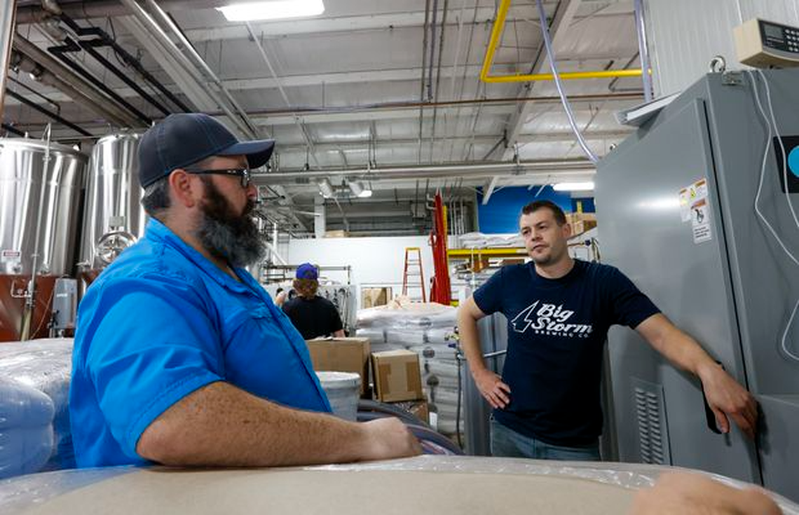 Big Storm Brewing Co. president LJ Govoni, left, talks with head brewer Joel Moore on Feb. 21 at the brewery in Clearwater.